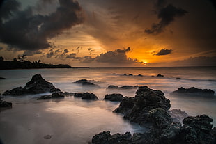 high angle view photo of rocks over body of water during sunset, vieques