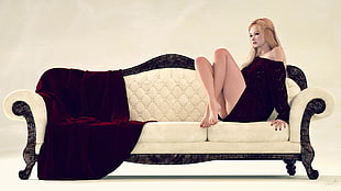 woman sitting on white suede couch