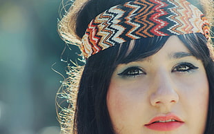 woman wearing multicolored chevron head accessory