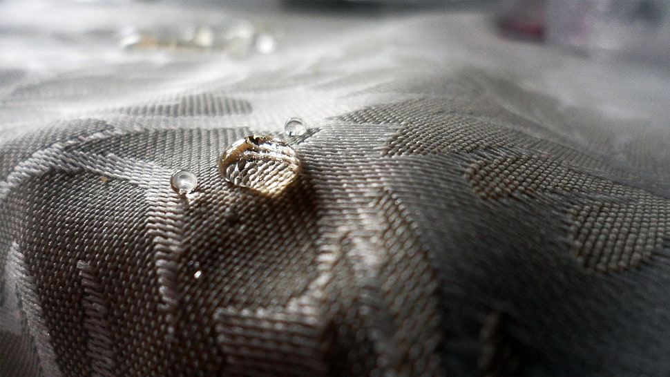 silver-colored leaf shaped accessory on gray floral textile HD wallpaper