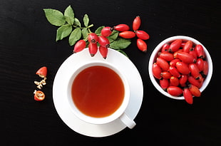 oval red fruits and tea