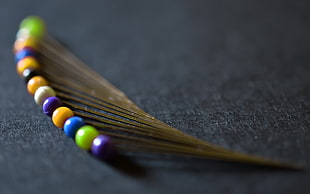 closeup photography of multicolored hair pin