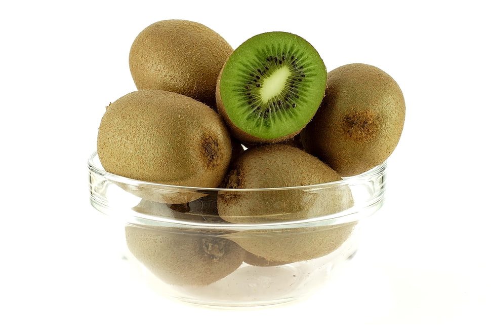 Kiwi fruits on clear glass bowl HD wallpaper