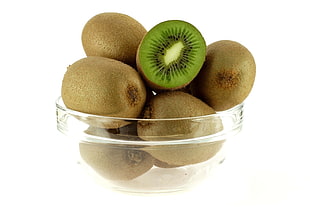 Kiwi fruits on clear glass bowl