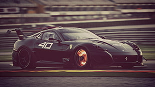 black Ferrari sports car on road