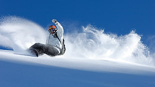 man playing snowboard