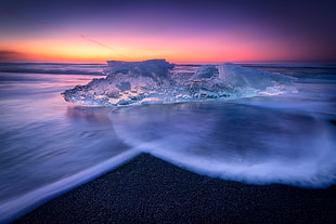 time lapse photography of ice burg on body of water HD wallpaper