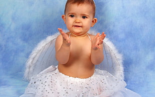 baby wearing angel wings photo