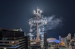 brown tower with fireworks display, skyscraper, cityscape, building, fireworks