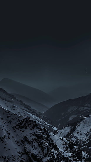 photo of mountains during night time
