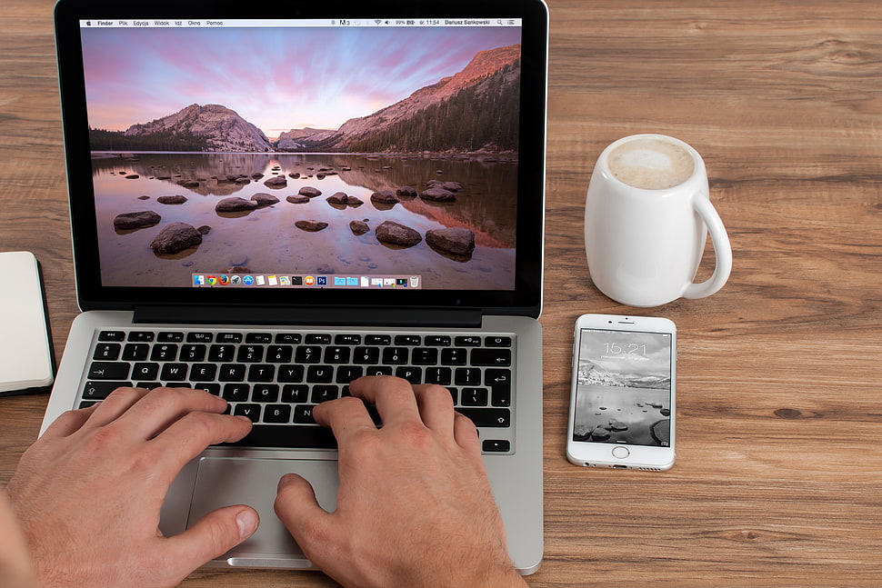 person using silver Macbook HD wallpaper