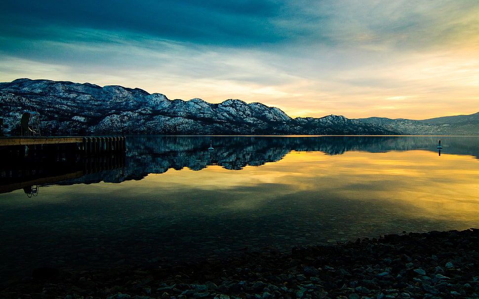 lake near on mountain HD wallpaper