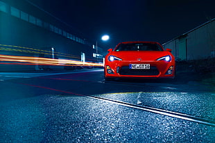 photography of red Toyota GT86