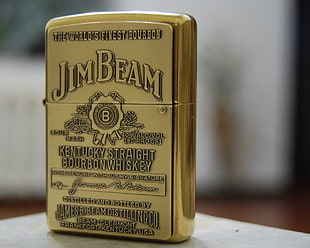 macro shot of brass Jim Beam flip lighter