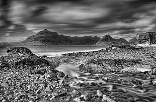 grayscale photography of sea beside mountain, elgol