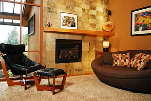 two brown cushion pillows on brown couch