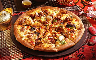overload slice pizza on round wooden tray
