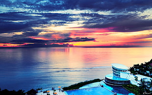 white and red lighthouse painting, sunset, sea, sky, clouds