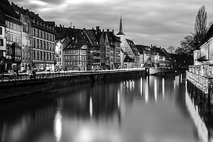 grayscale photo of river in the middle of the city, strassburg