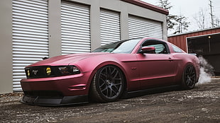 photo of red Ford Mustang coupe