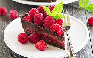strawberry chocolate cake on white ceramic plate