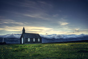 chapel on green grass field under white stratus clouds during daytime HD wallpaper