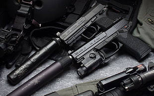 two black semi-automatic handguns