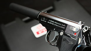 selective photography of black pistol HD wallpaper