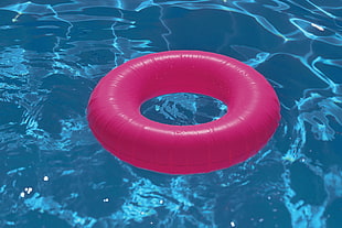 pink life buoy on pool