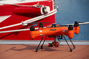 orange and black quadcopter drone HD wallpaper