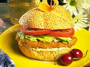 Burger on yellow ceramic plate
