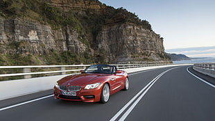 red BMW convertible car on the road HD wallpaper