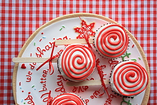 three cupcakes with swirls