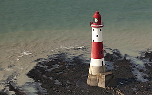 white and red concrete lighthouse near body of water, nature, lighthouse, beach