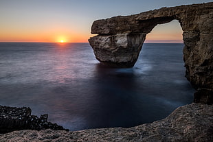 landscape photography of rock surrounded by bodies of water, san lawrenz, malta HD wallpaper
