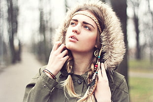 woman in grey buttoned parka coat