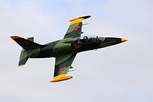 green and yellow fighting jet in scene