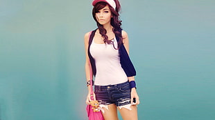 woman in white tank top with black cardigan and black denim short shorts carrying pink bag