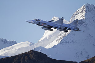 two silver fighter jets on top of mountain covered in snow during daytime HD wallpaper