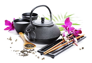 black and gray teapot and pair of chopsticks
