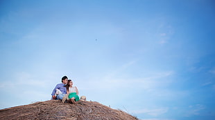 couple on brown mountain during daytime