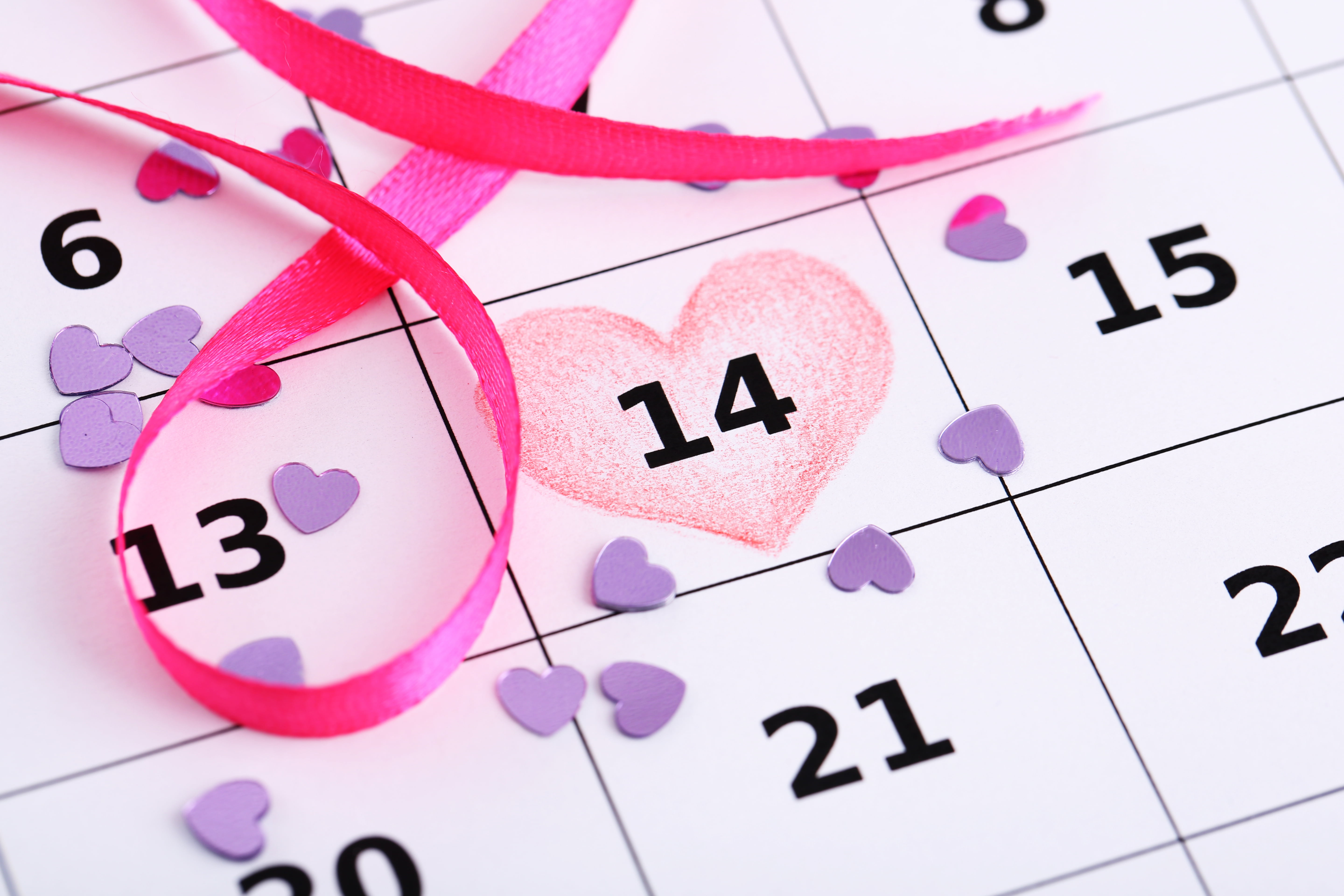 white and black 14 calendar date with heart illustration and pink ribbon lace