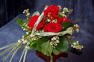 bouquet of four red roses
