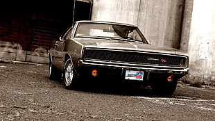 parked classic black Dodge Charger R/T during daytime