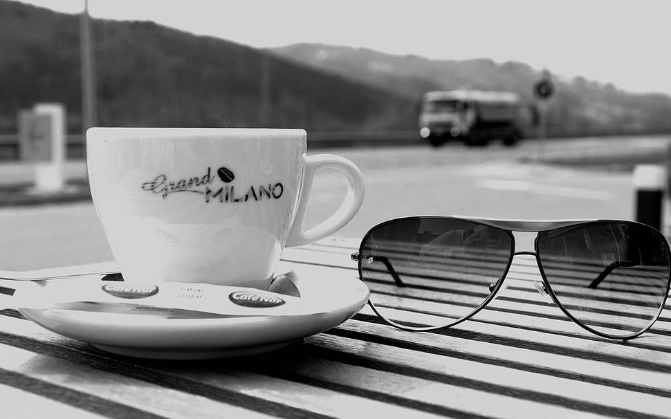 white ceramic cup and saucer beside black aviator sunglasses HD wallpaper