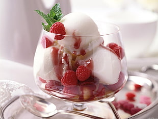 white and red cherry ice cream in glass goblet