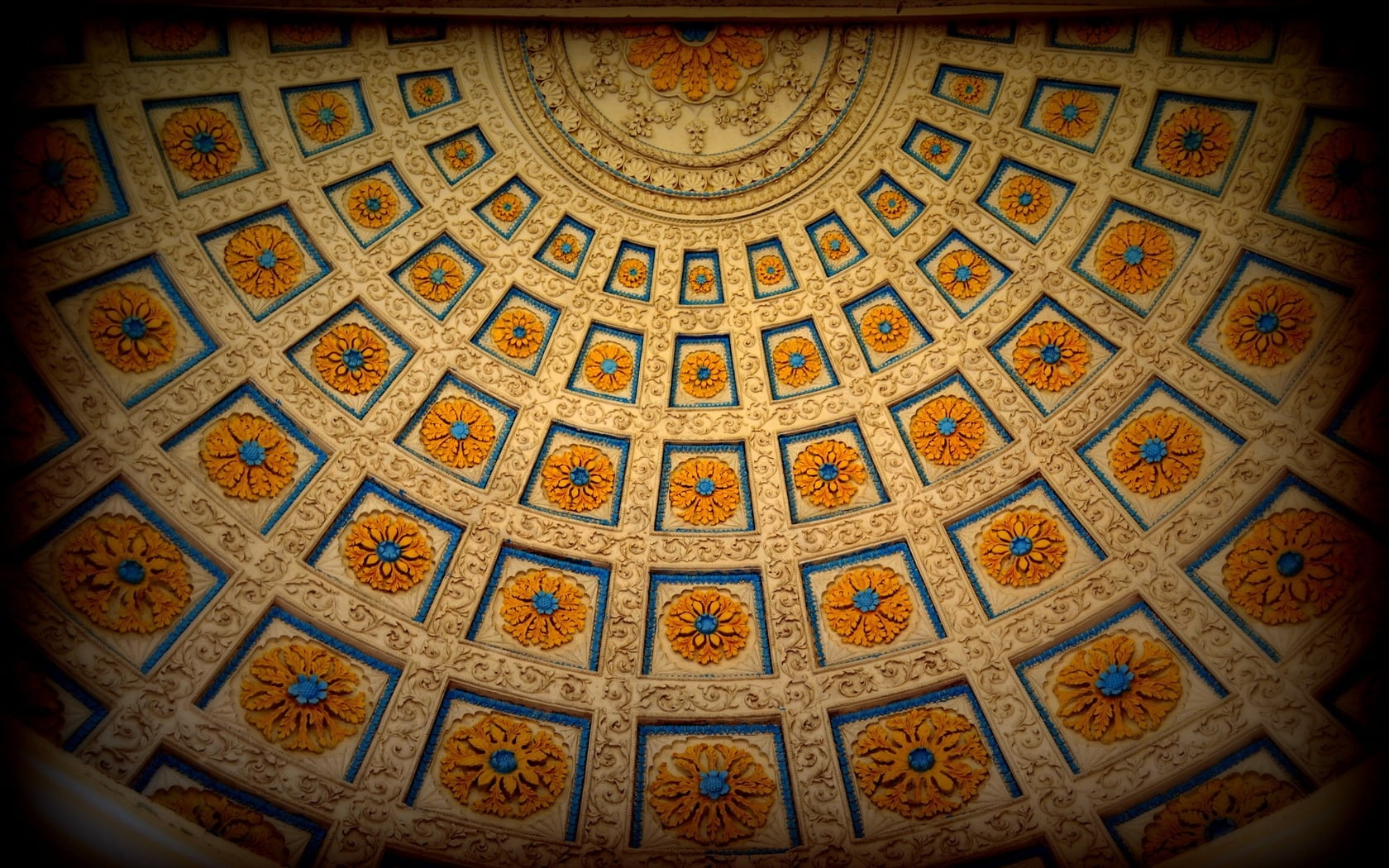 beige, orange, and blue floral building interior