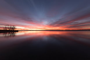 photography of body of water during sunset