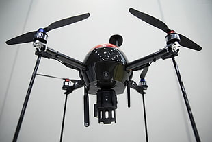shallow focus photography of black quadcopter drone