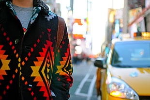 black, yellow, and orange button-up jacket, hoods, taxi, car, New York City